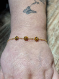 Bracelet doré fleurs ambrées