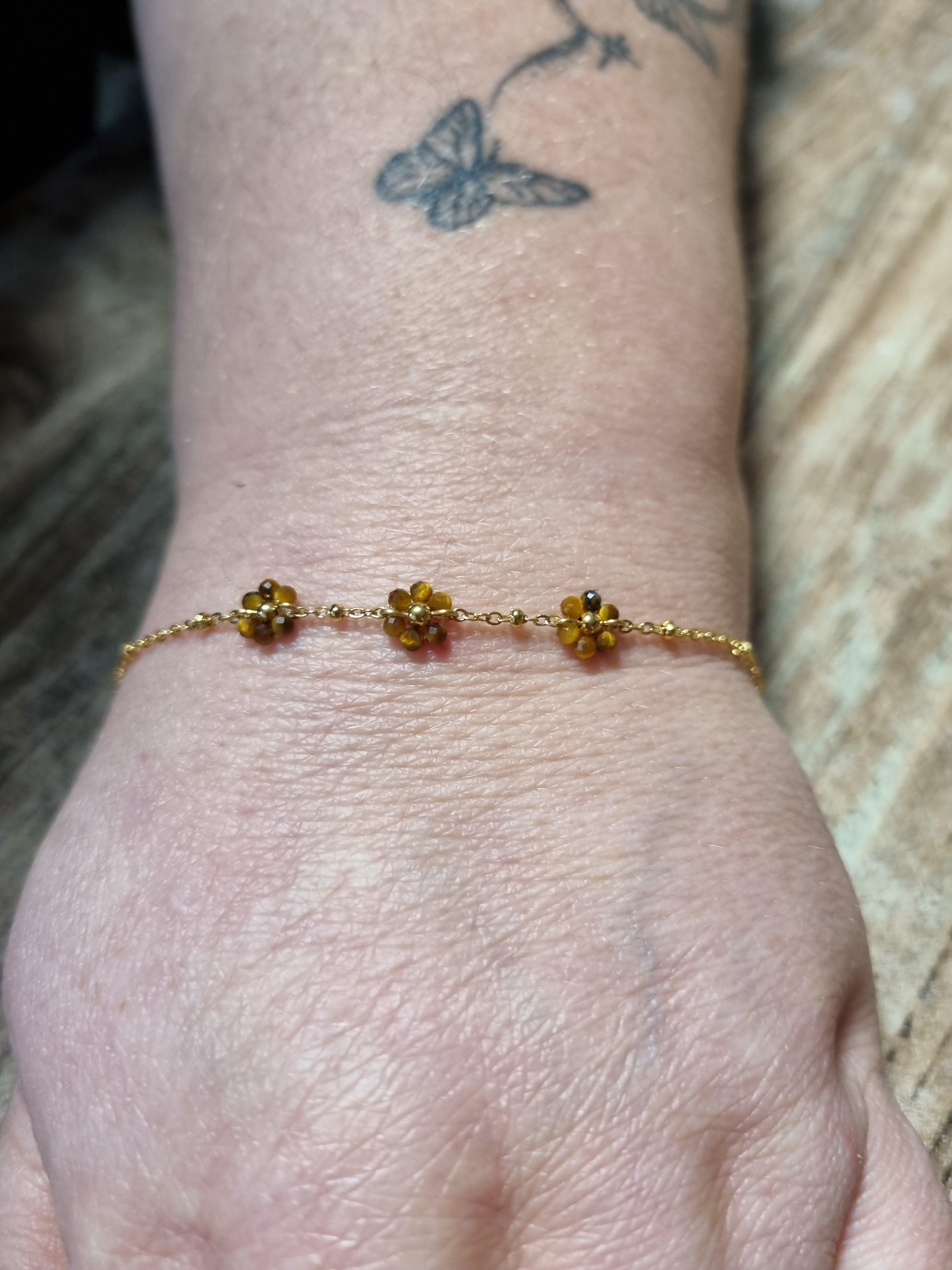 Bracelet doré fleurs ambrées