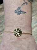 Bracelet doré médaillon solaire