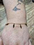 Bracelet doré plumes