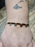 Bracelet doré perles noires